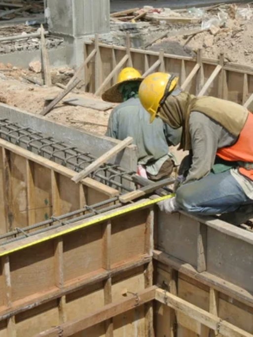 depositphotos_73965839-stock-photo-two-construction-workers-installing-ground
