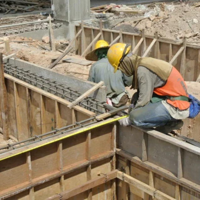depositphotos_73965839-stock-photo-two-construction-workers-installing-ground